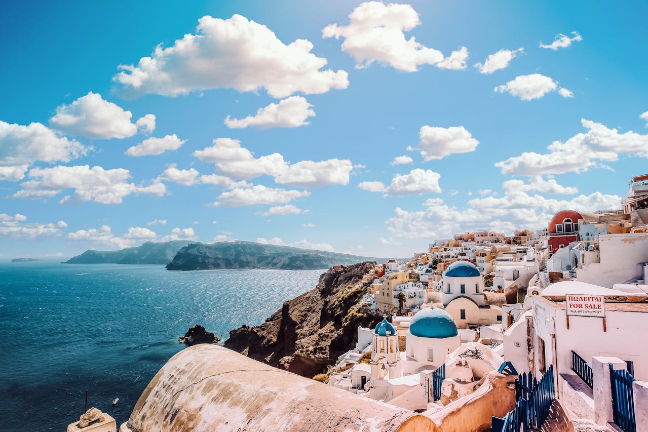 Beautiful sunset view of Santorini's white buildings and blue domes